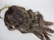 ERIN brown with blonde highlights fully wefted topper styled with waves