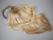 PAIGE rooted blonde topper styled with loose waves