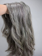 JOAN medium salt and pepper gray blend topper styled with waves