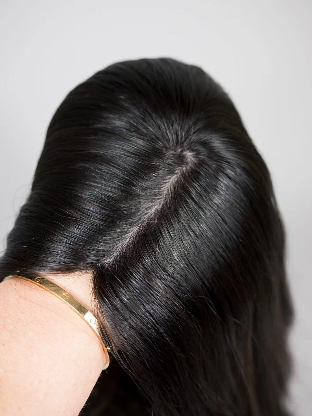 BLAIR soft black with brown highlights topper styled with waves